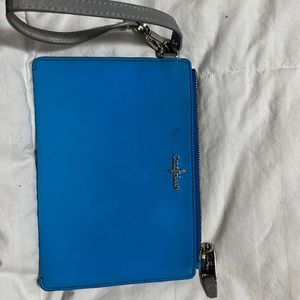 Cole Haan wristlet, bright blue. Has some staining.7 3/4 x 5 3/8